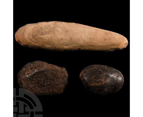 Neolithic Period, 8th-5th millennium B.C. Comprising a massive axe-shaped stone implement trimmed by knapping, with two pecke