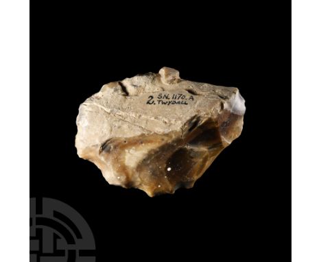 Lower Palaeolithic Period, circa 400,000 B.P.. An early hand axe formed on a thick, keeled flake, trimmed to edges; with inke