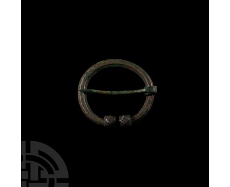 9th-11th century A.D. With facetted terminals with remains of stamped ring-and-dot and triangle ornament, facetted body with 