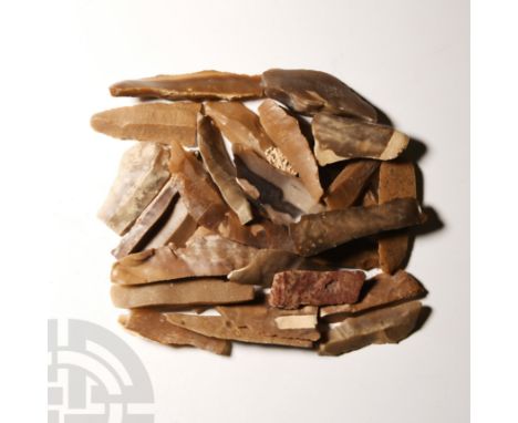 Neolithic Period, circa 6th millennium B.C. Comprising thirty knives and some other tools.   237 grams total, 39-70 mm (1 1/2