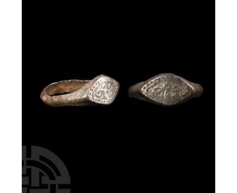 10th-12th century A.D. With beaded border to the bezel, pounced field and reserved scrolled cruciform motif. Cf. Chadour, A.B