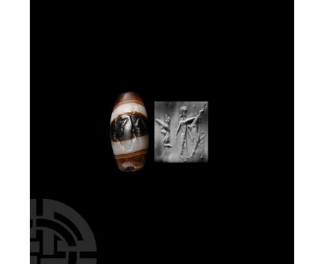 2nd-1st millennium B.C. and later. Barrel-shaped with frieze depicting a human hero with a sword attacking a leaping deer and