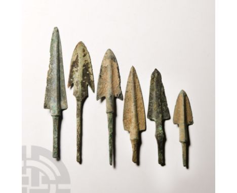 12th-10th century B.C. Comprising six tanged arrowheads, all with large elongated triangular blades and raised midrib, sharp 