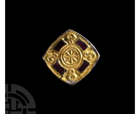 6th-7th century A.D. The edges slightly bowed, raised rim enclosing an S-scroll motif in each angle, four rectangular cells e