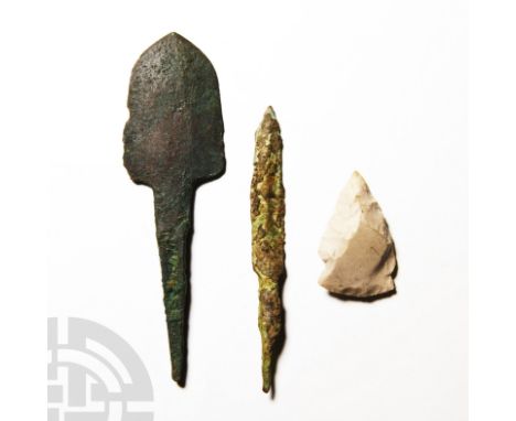 3rd-1st millennium B.C. The mixed group comprising a knapped stone arrowhead and two tanged copper-alloy arrowheads of differ