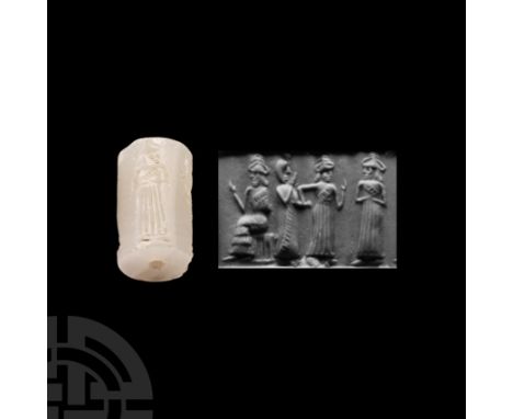 2nd-1st millennium B.C. With incised frieze of a seated figure extending his hand to a standing figure in floor-length pleate