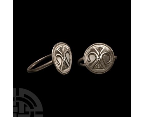 15th-16th century A.D. With slender round-section hoop supporting a discoid bezel with incuse stylised fleur-de-lys. Cf. Chad
