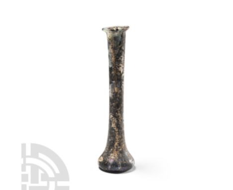 2nd-3rd century A.D. Tall thin iridescent vessel with wide base and flared rim. Cf. Whitehouse, D., Roman Glass in the Cornin
