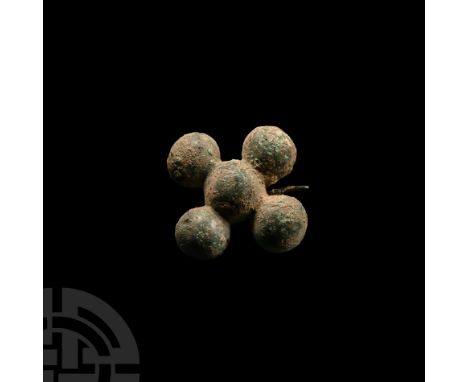 4th-1st century B.C. Complete with swivel bar and pin to reverse; the cruciform body composed of four bulbous arms with conca