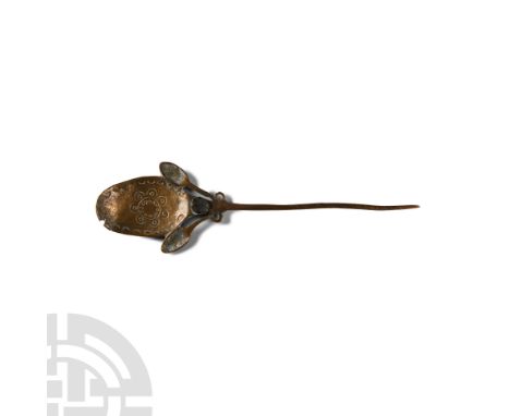 18th-19th century A.D. The central spoon-shaped section, the bowl decorated with a punched floral design framed by crescents,