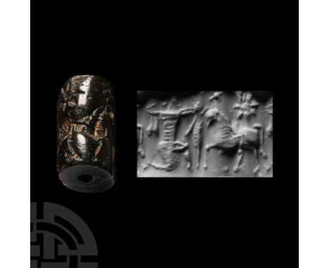 2nd-1st millennium B.C. A kneeling bowman among fronds drawing his bow towards an advancing bull. Cf. Teissier, B., Ancient N