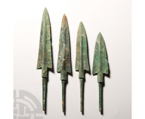 13th-9th century B.C. Comprising four tanged arrowheads, having large elongated triangular blades and raised midrib, sharp ce