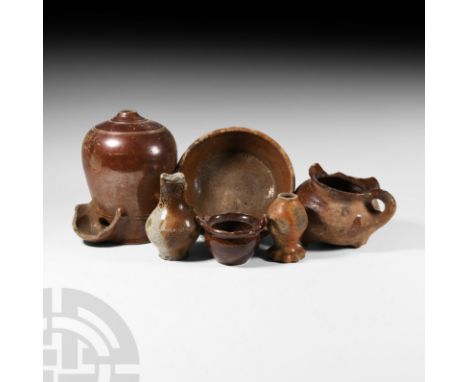 15th century A.D. and later. Including a jar with scalloped foot, a piriform juglet, footed pot with handle, small jar with r