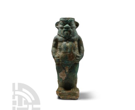 Late Period, 664-332 B.C. With integral square base and shallow socket to the top of the head; Bes shown standing nude with h