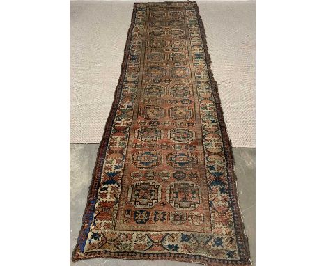 PERSIAN TYPE WOOLLEN CARPET RUNNER  with repeating central block pattern and triple bordered edge, 370 x 101cms