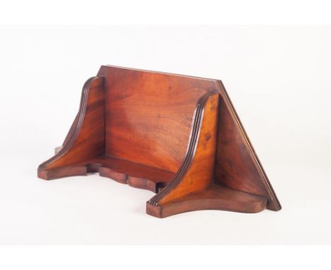 EARLY TWENTIETH CENTURY FIGURED MAHOGANY WALL BRACKET, the half hexagonal top with two brackets with reeded edges, 24" (61cm)