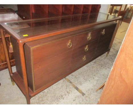 A contemporary Clanbay Lino walnut sideboard with inset glass top in open frame, above three central drawers flanked by twin 