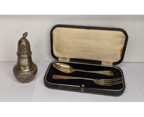 A boxed set to include a silver fork and teaspoon A/F, hallmarked 1903 together with a silver caster, hallmarked Sheffield 18