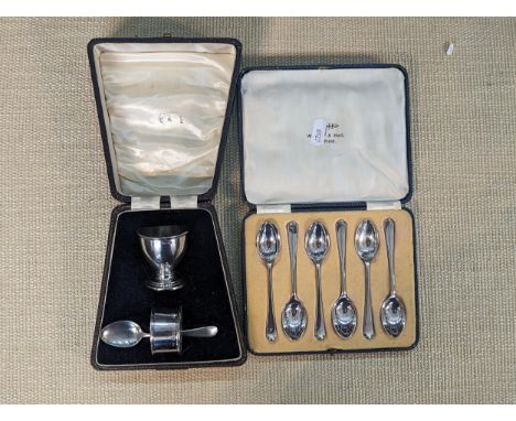 A cased set of six silver spoons, together with a 1940 boxed silver Christening set (napkin ring hallmark 1938)Location: 5:1 