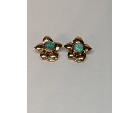 A pair of 9ct gold earrings in the form of a flower inset with opal, total weight 3.7gLocation: 