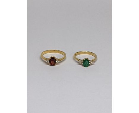 Two 18ct gold rings to include an 18ct gold ring inset with central emerald and flanked with six diamonds together with an 18