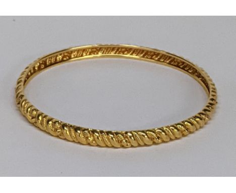 A yellow metal bangle, total weight 9.7gLocation: 