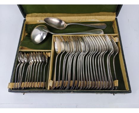 A French silver plated English pattern canteen of cutlery comprising twelve table forks, twelve table spoons, nine teaspoons 