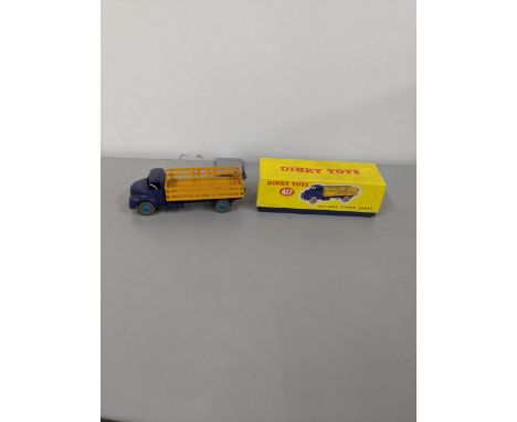 Dinky Toys no 417 Leyland Comet lorry comprising violet blue cab chassis and a yellow back with blue wheelsLocation: 