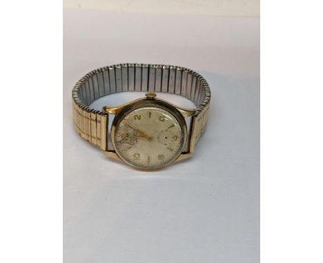 A 9ct gold cased manual wind watch on an expanding gold plated bracelet A/FLocation: 
