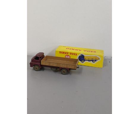 Dinky Toys No 408 Big Bedford lorry, maroon cab and chassis, light tan back with cream hubsLocation: 