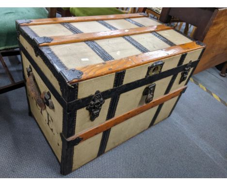A late 19th century Fitzgerald canvas bound trunk, 54cm h x 77cm wLocation: 