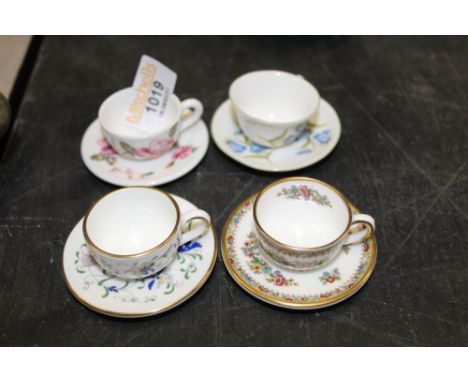 Four modern bone china dolls house tea cups and saucers including Coalport. 