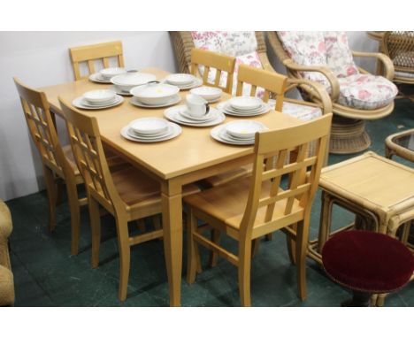 Light wood extending dining table and 6 chairs