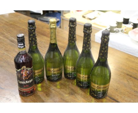 Bottle of Captain Morgan Rum, 70 cl, four bottles of Dry Don Luciano sparkling wine and one demi sec