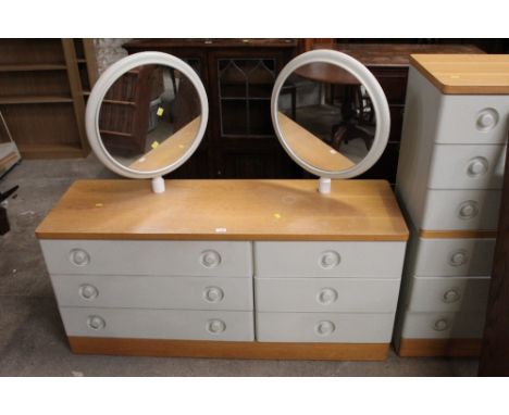 A Stag light oak and cream painted dressing table, fitted two circular adjustable mirrors and six drawers, 138 cm wide x 44 c