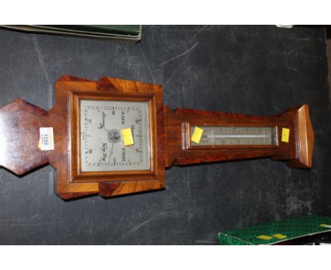 A 1930's style figured walnut barometer, with thermometer scale, 60 cm