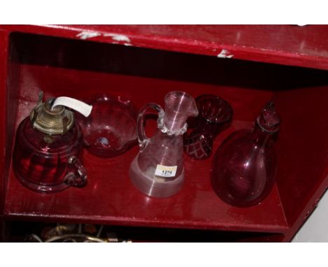 A Victorian clear and pink tinted ewer engraved with flowers, 18 cm high, a late Victorian Cranberry glass table oil lamp bas