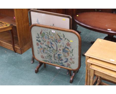 A fire screen/occasional table with mahogany frame, tapestry and glazed top, and another with floral embroidered front