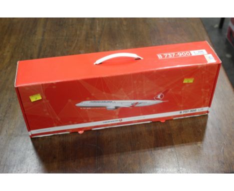 A boxed model aeroplane of a Turkish Airlines 737-900, scale 1-100