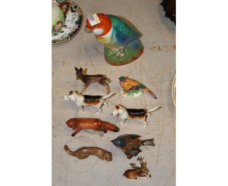 A Tremar stoneware model of an otter, four Beswick pottery figures - fox, two hounds, and a chaffinch and four other porcelai