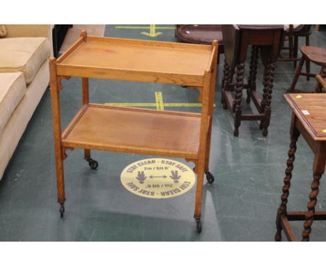 A light oak tea trolley