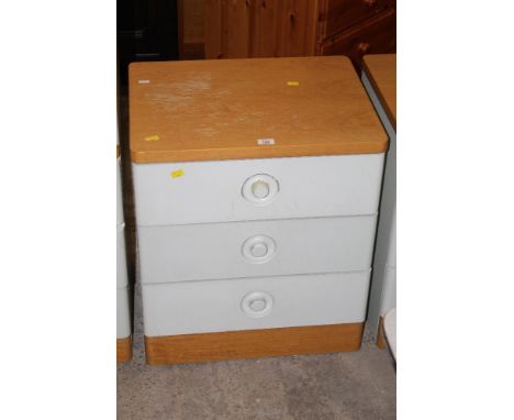 A Stag light oak and cream painted three drawer bedroom chest, 56 cm wide x 46 cm deep x 64 cm high (slight wear)