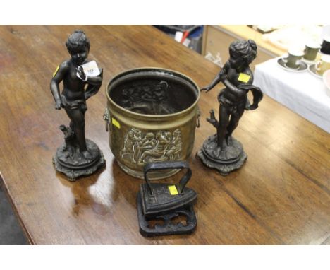 Two spelter style figurines, planter, trivet and flat iron