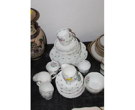 A Susie Cooper bone china tea service, decorated with pink roses, design No. C440 (48 pieces) 
