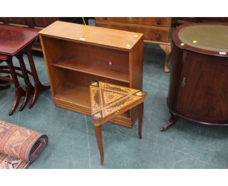 A light oak two tiered bookshelf and a triangular inlaid musical sewing box 