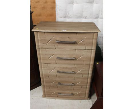 A light oak finish five drawer bedroom chest, 80 cm wide x 47 cm deep x 123 cm high (one handle dented)