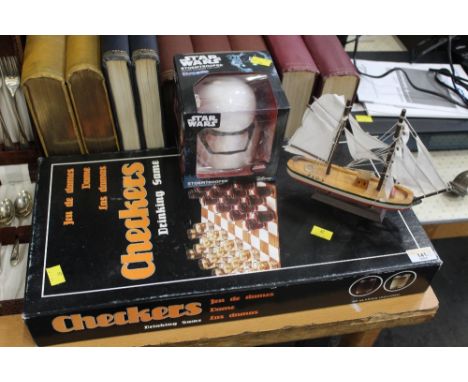 Checkers drinking game, Star Wars Storm Trooper led light and a model boat 