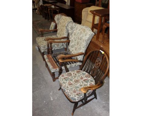 An Ercol elm armchair with pierced splat and a pair of 1930's cottage style wing chairs