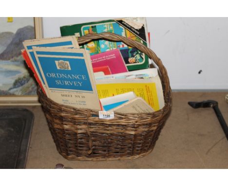 A wicker basket of mixed ordnance survey and other maps.