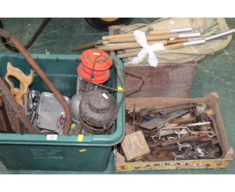 A plastic box of vintage tools, storm lamps, a wooden crate of vintage tools and a vintage Scotch Whisky bottle crate with co